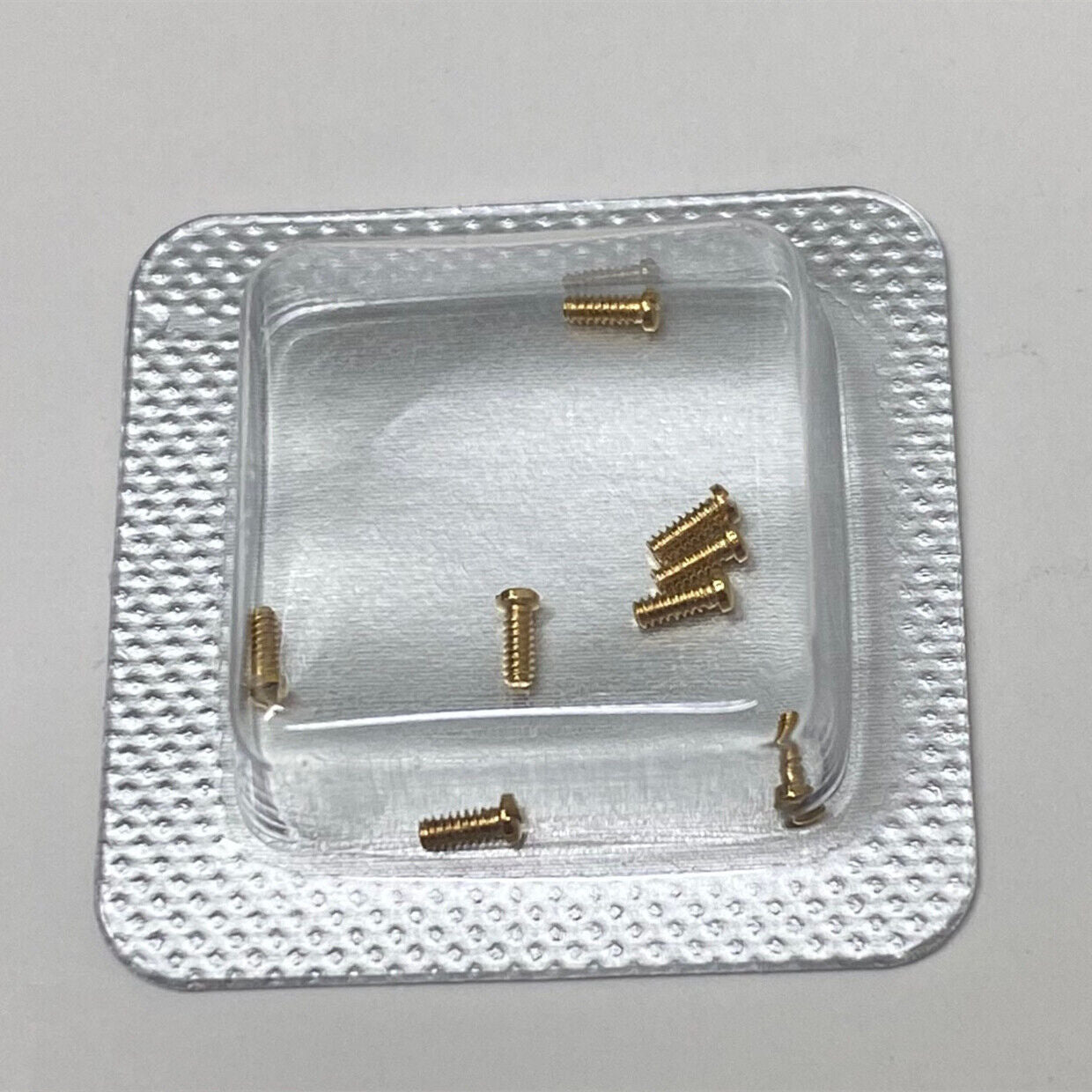 Durable 3x1mm slotted back cover screws for Cartier men's watches, precise replacement parts.