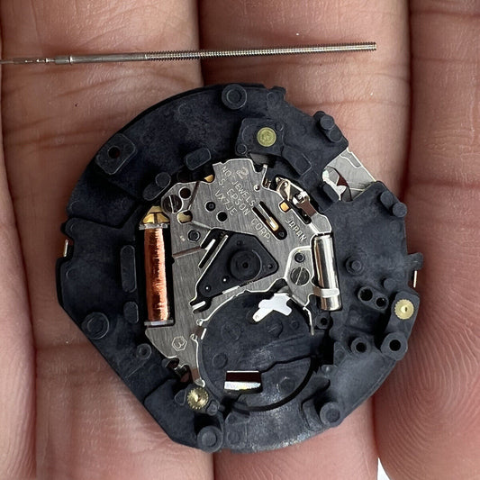 Japan-made Hattori Epson TMI VX7J quartz watch movement with stem for precise timekeeping.