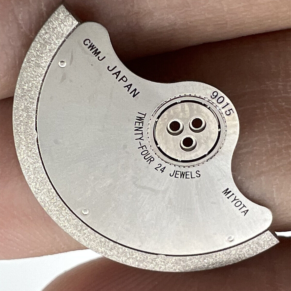 Rotor oscillating weight for Miyota 9015 watch movement, precision part enhancing automatic winding efficiency.