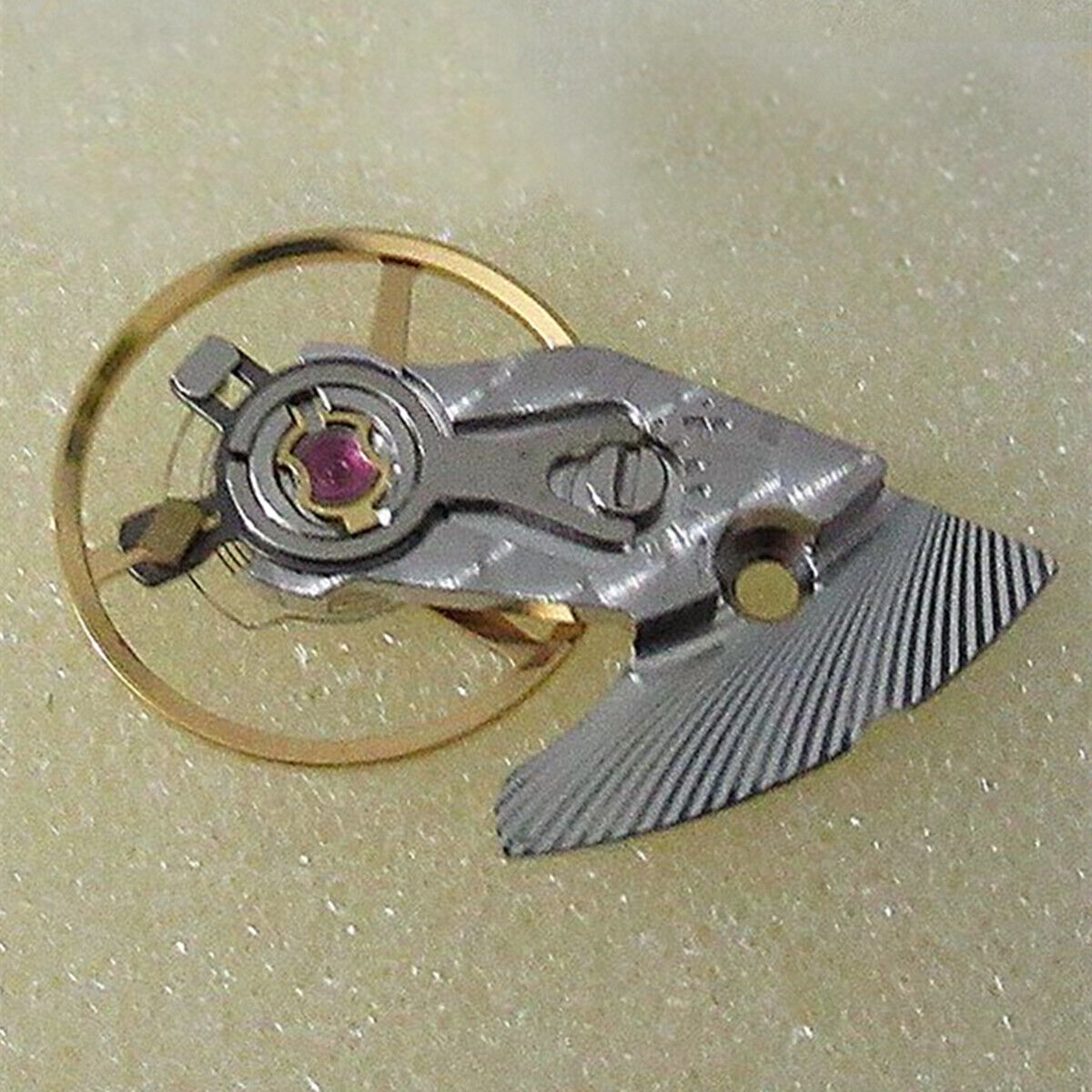 Swiss Made silver watch balance wheel with splint for ETA 2892 movement, precision timing.