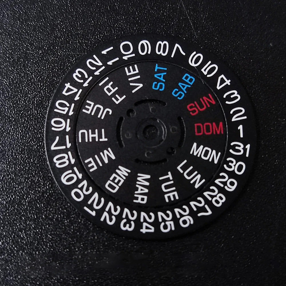 NH36 watch movement with hand-held calendar date disc wheel and day match features.