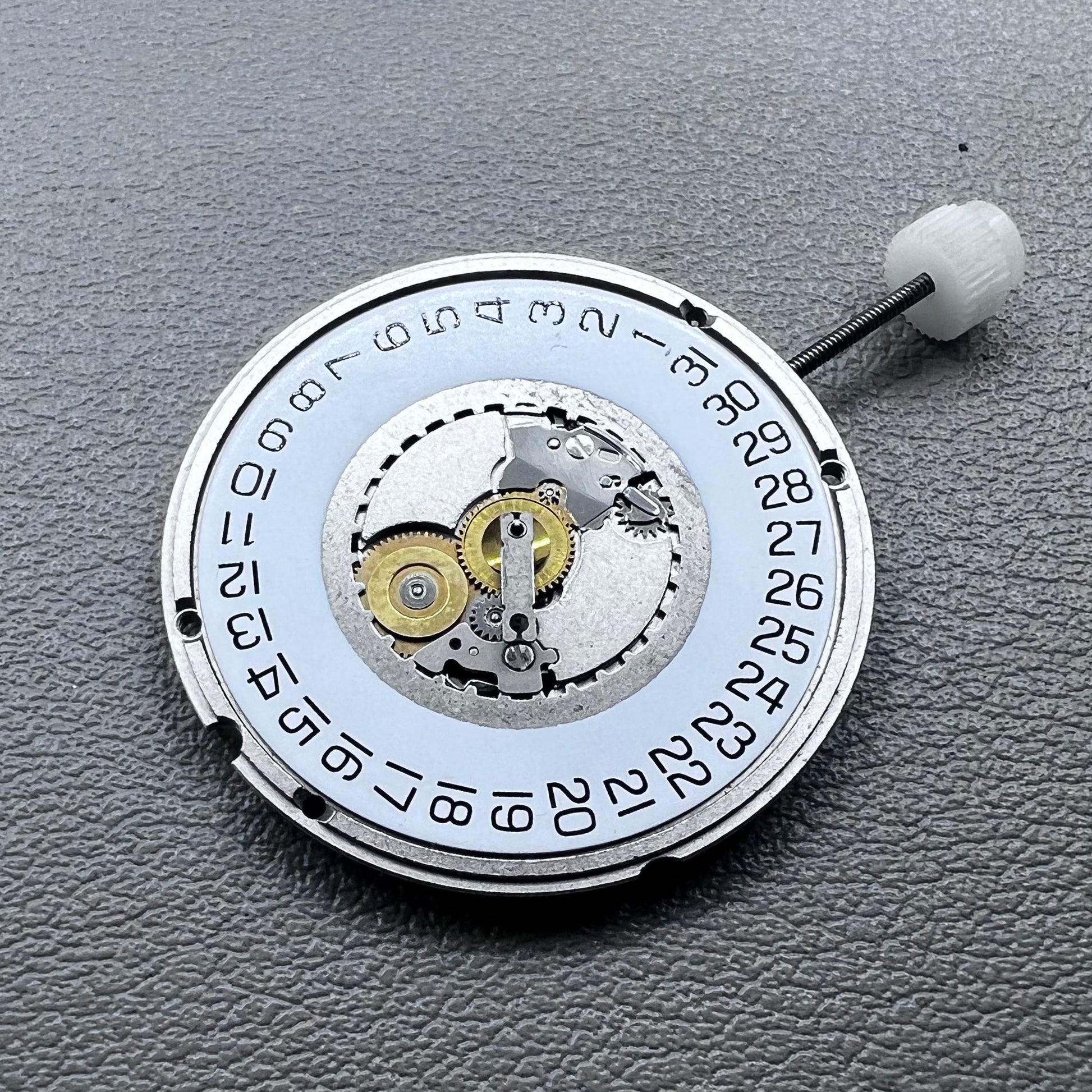 Swiss ETA 955.114 quartz movement with 3 hands for precise watch accessory replacement.
