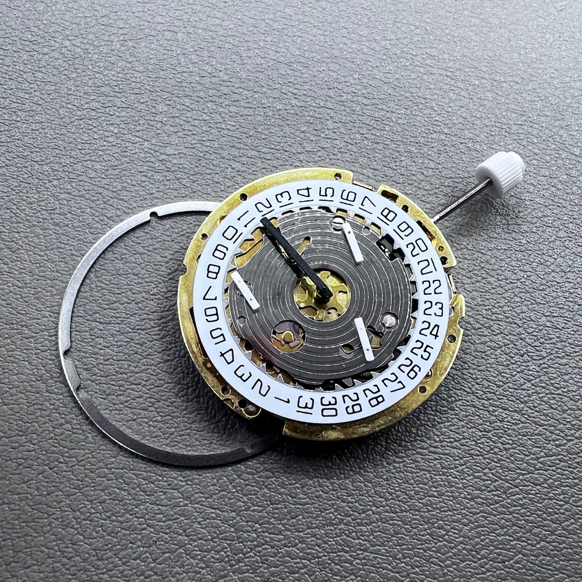 Swiss ISA 8171 golden quartz watch movement with date at 4 o'clock, multi-function design by Swiss ISA.