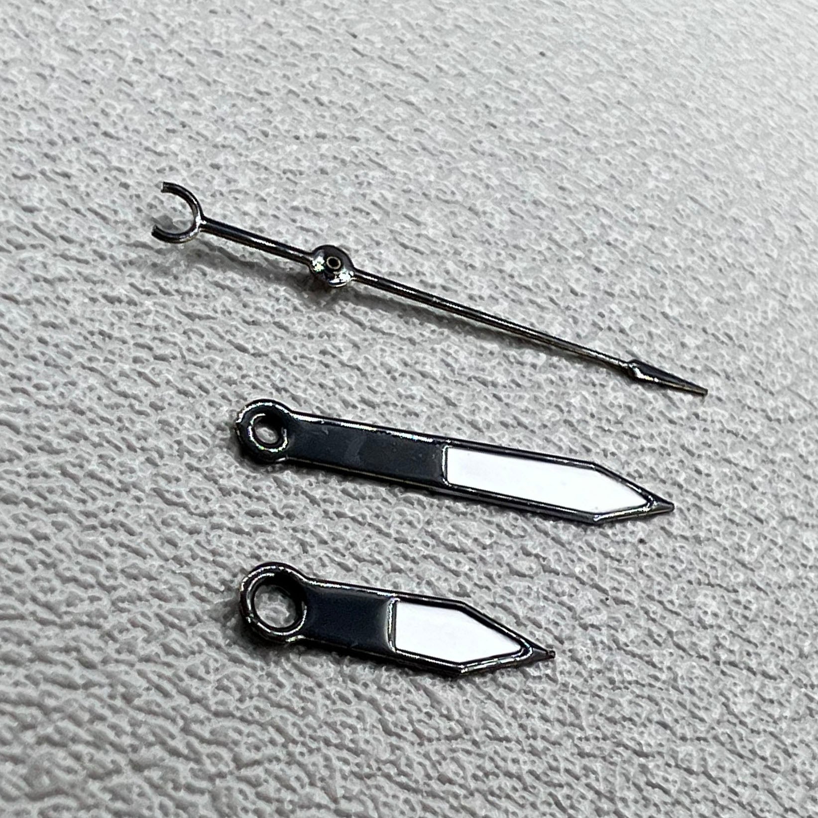 12mm black arrow-shaped watch hands with trim, compatible with Hattori PC32 quartz movement.