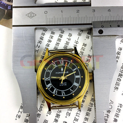 33mm Dandong manual watch with 17 jewels, black dial, gold markers, and three-hand movement by Dandong.