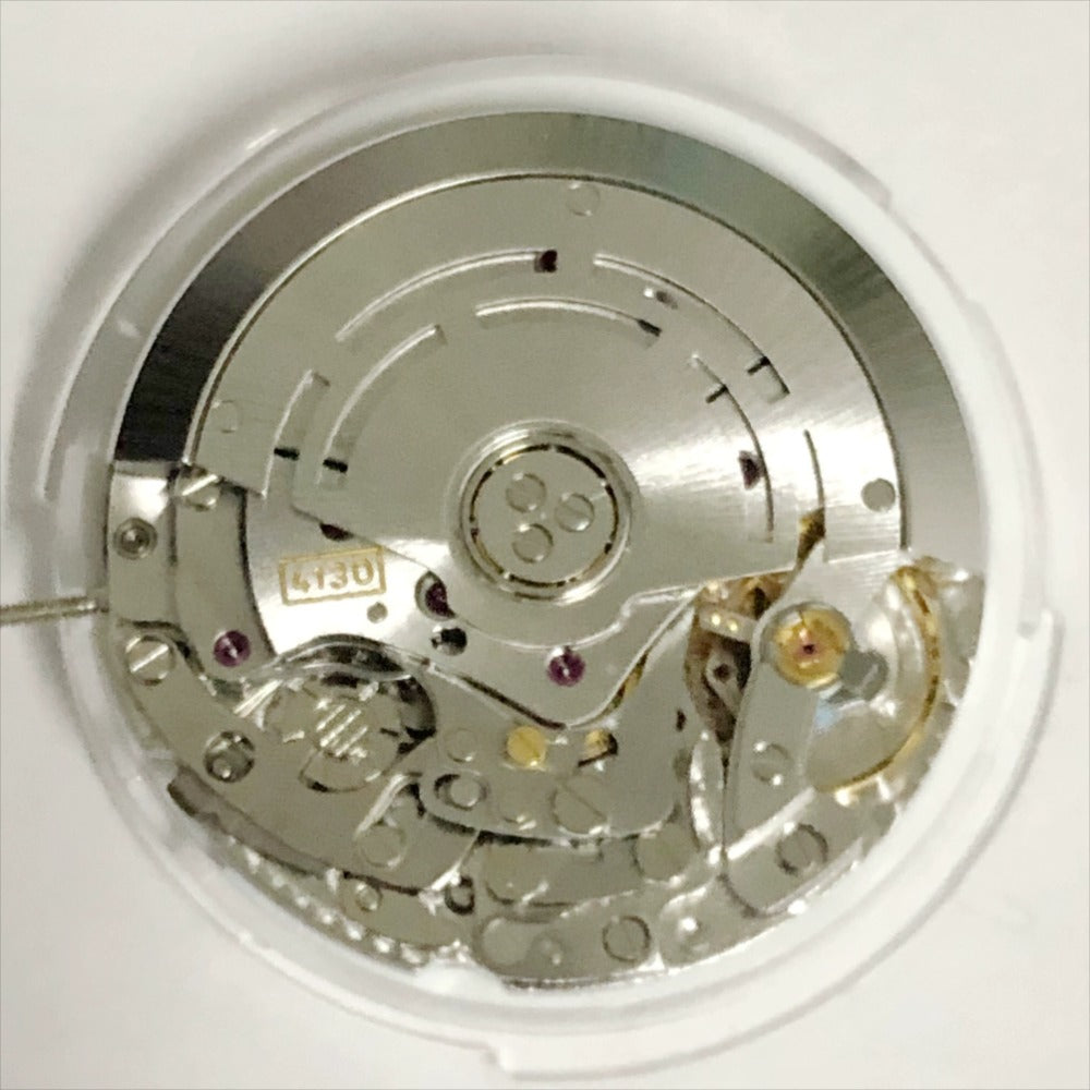 Shanghai 4130 automatic watch with small second hand at 3, 6, and 9 o'clock positions, China-made precision.