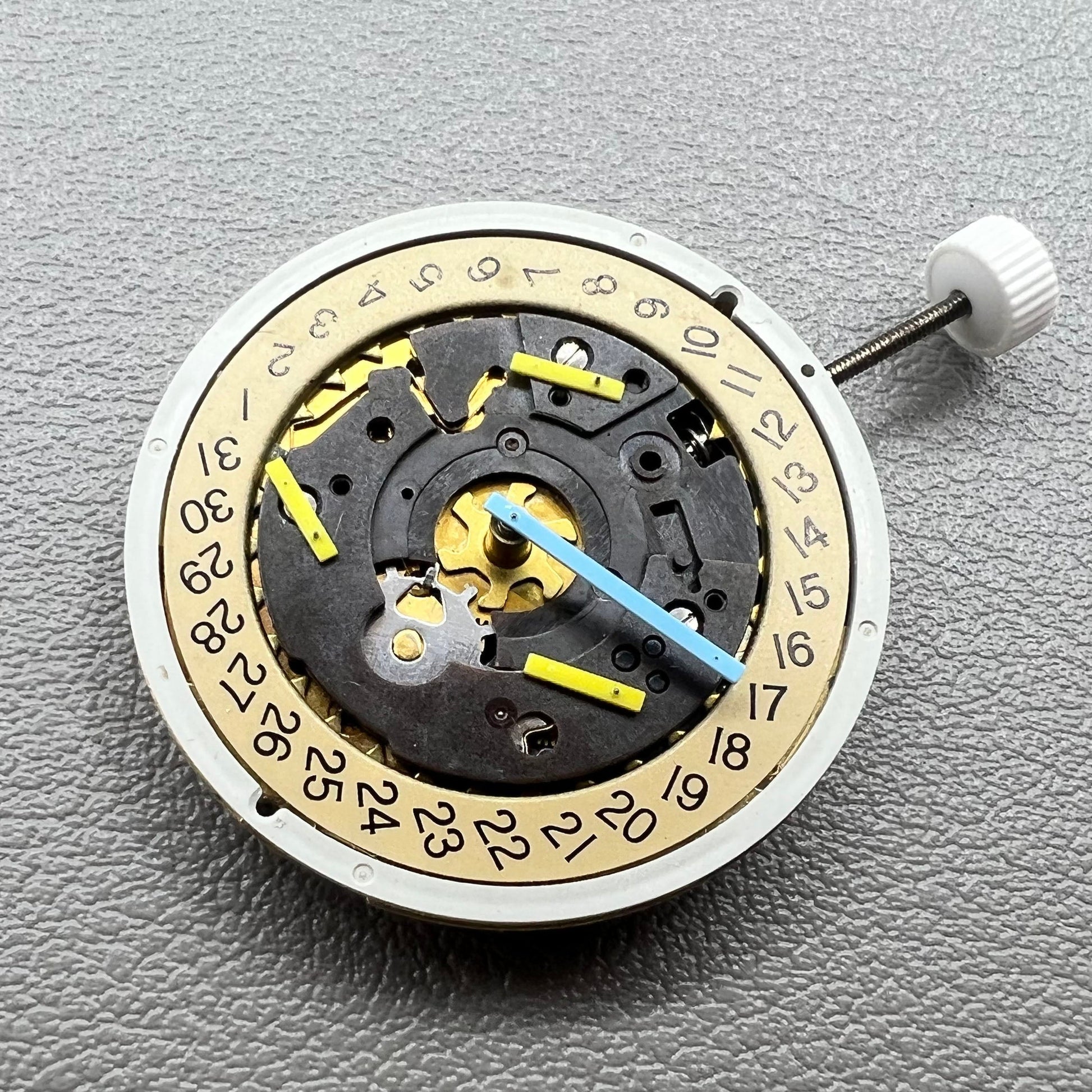 Swiss ISA 8162 golden watch disk with date feature, quartz movement replacement by ISA, ideal for watch repair.