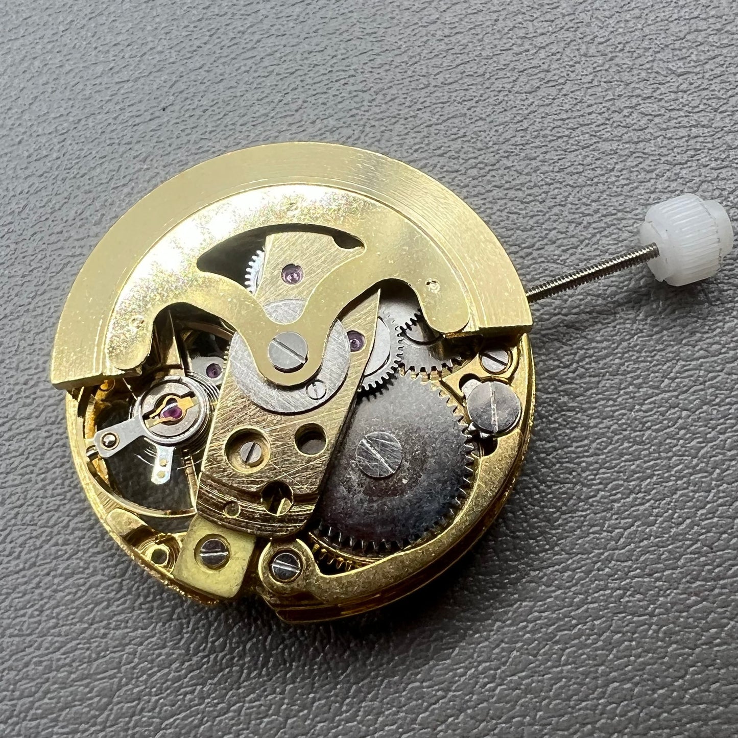 Golden 26.5mm hollow carved watch accessory with automatic 7120 mechanical movement, precision-engineered.