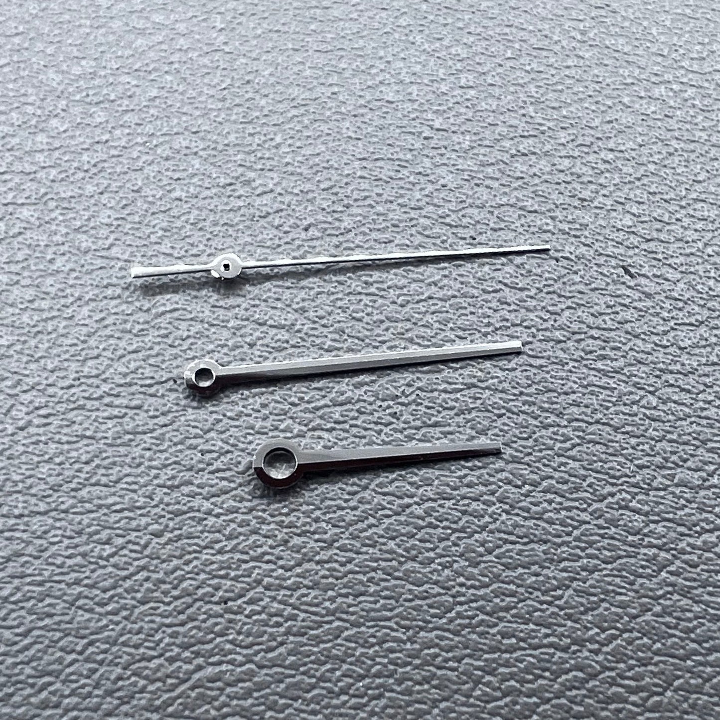 Silver 3 hands for ETA C07.111 movement, no lume, modified design by T086 for watch accessories.