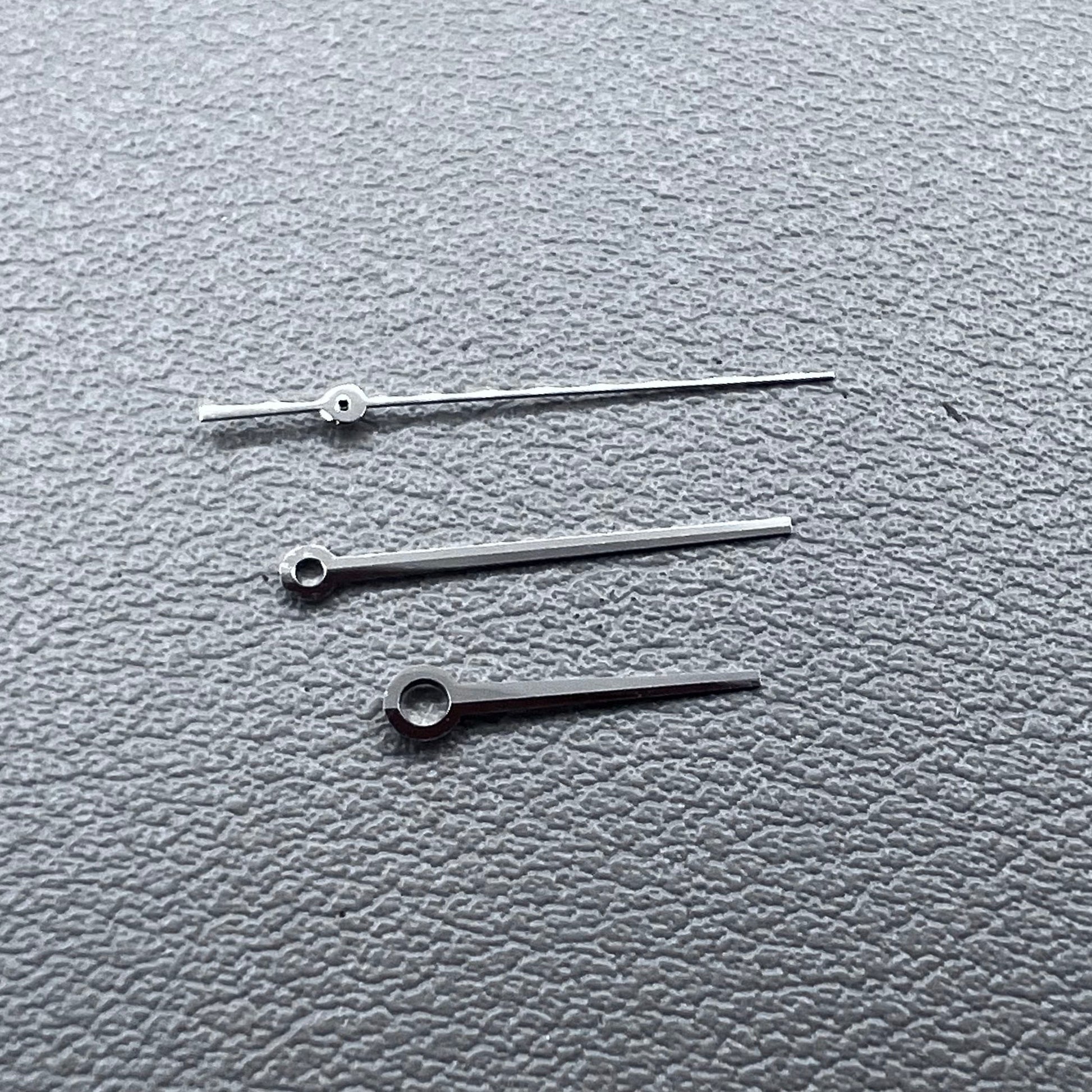 Silver 3 hands for ETA C07.111 movement, no lume, modified design by T086 for watch accessories.