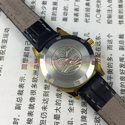 Tianjin Seagull ladies watch with black round case, gold nail markers, and manual mechanical movement.