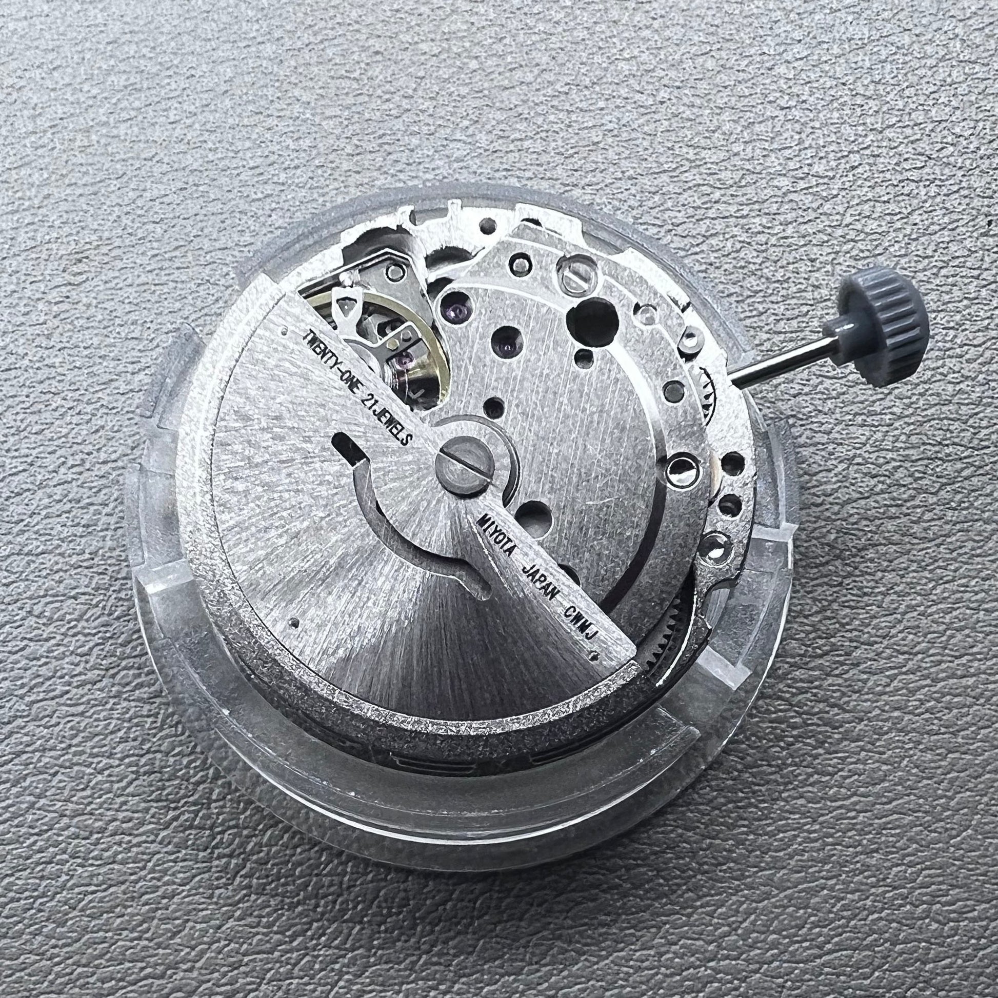 Japan Miyota 8215 automatic watch movement with black dial and date display at 6 o'clock by Miyota.