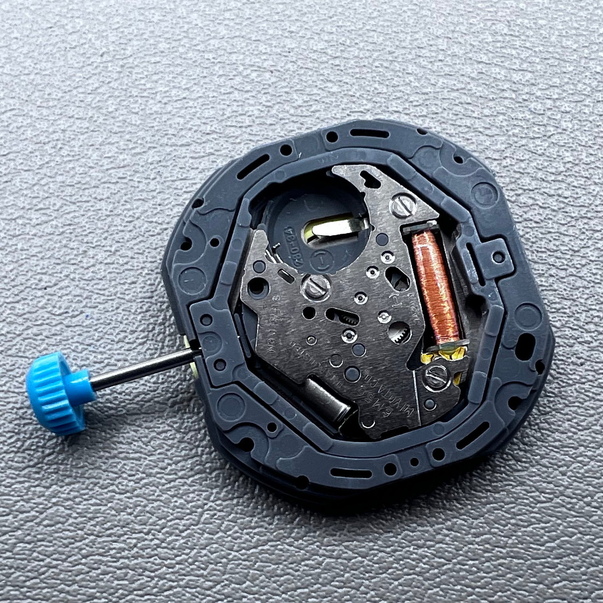 Japan Miyota 6M50 Quartz watch movement with golden dial, date at 6 o'clock, 3 hands, precise timekeeping.