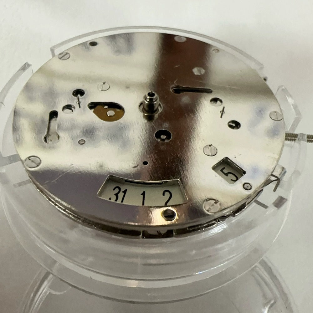 Close-up of China Made 2813 8205 automatic mechanical movement showcasing 5 functional hands for precise timekeeping.