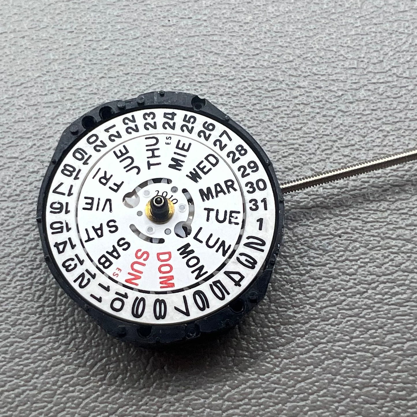 Japan PC23A Quartz watch movement showing 3 hands and double calendar functionality for precise timekeeping.