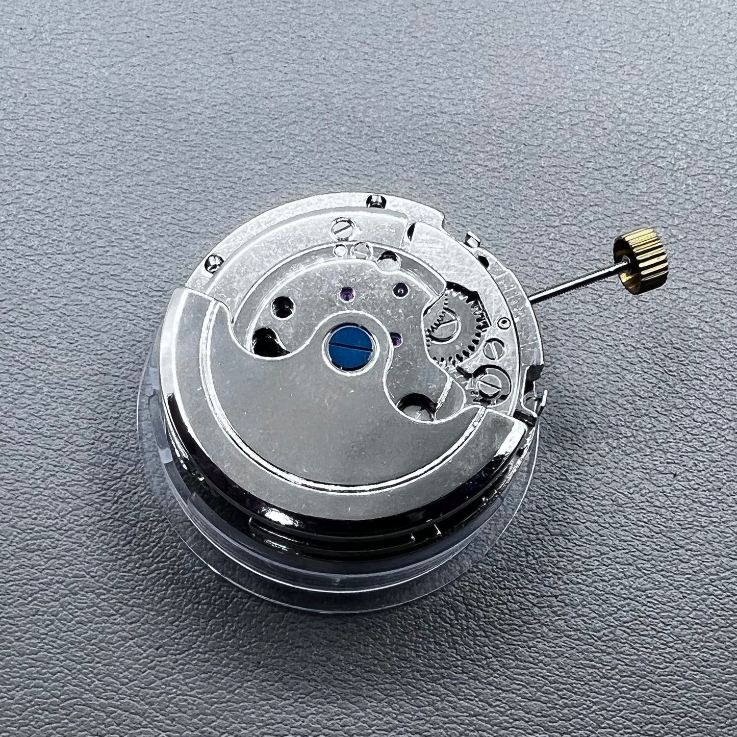 Silver Asian Dandong automatic watch with mechanical movement, date and week indicators, moon phase display.