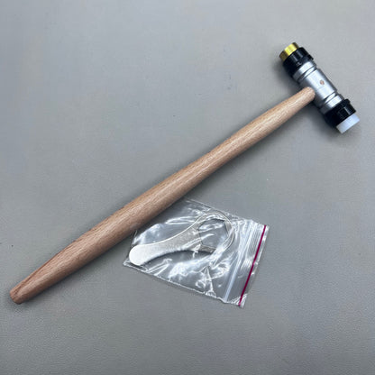 Swiss Tool Bergeon 30417 hammer with replaceable brass and synthetic ends for delicate watch repair tasks.