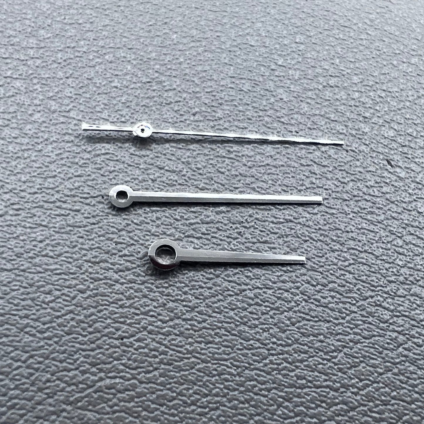 Silver 3 hands for ETA C07.111 movement, no lume, modified design by T086 for watch accessories.