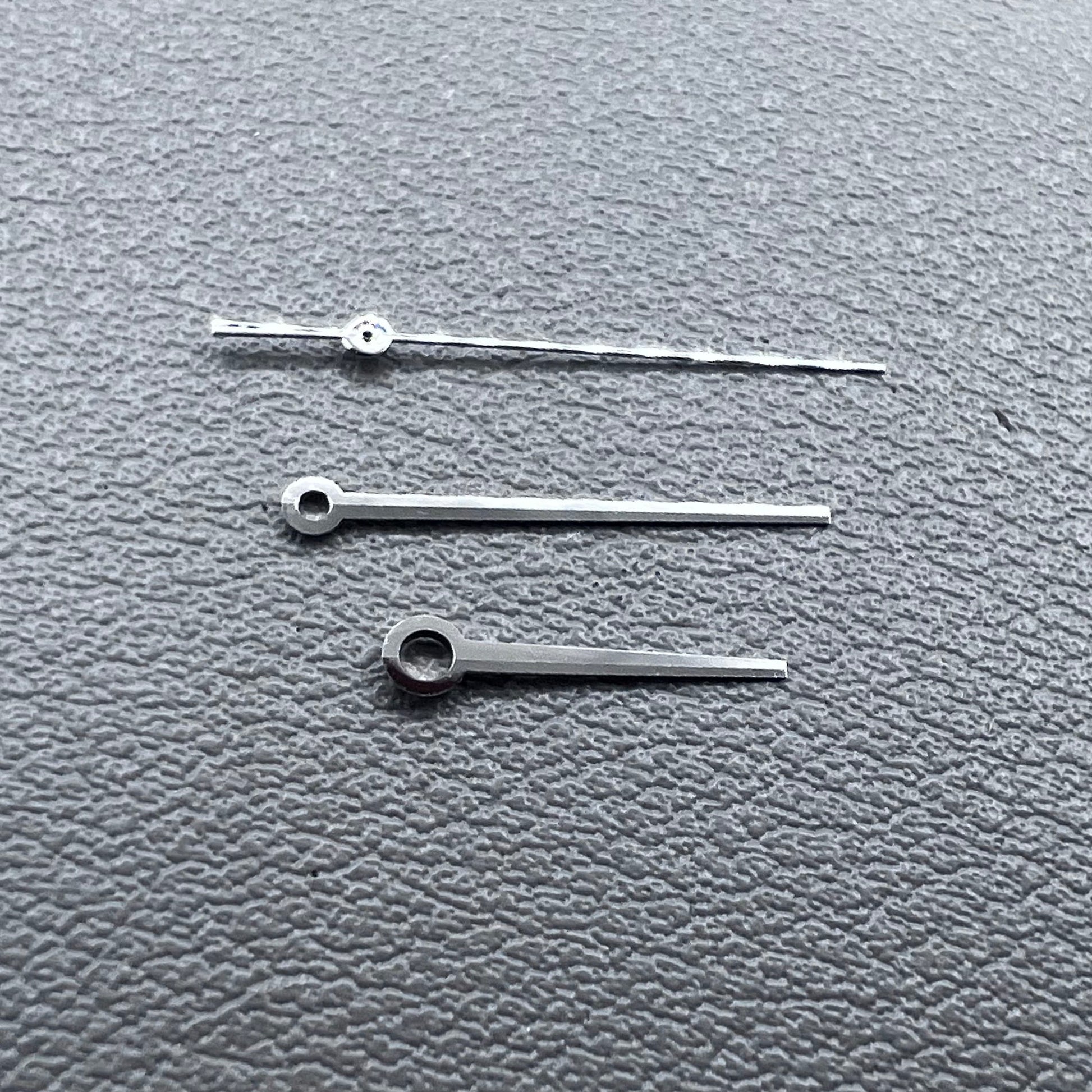 Silver 3 hands for ETA C07.111 movement, no lume, modified design by T086 for watch accessories.