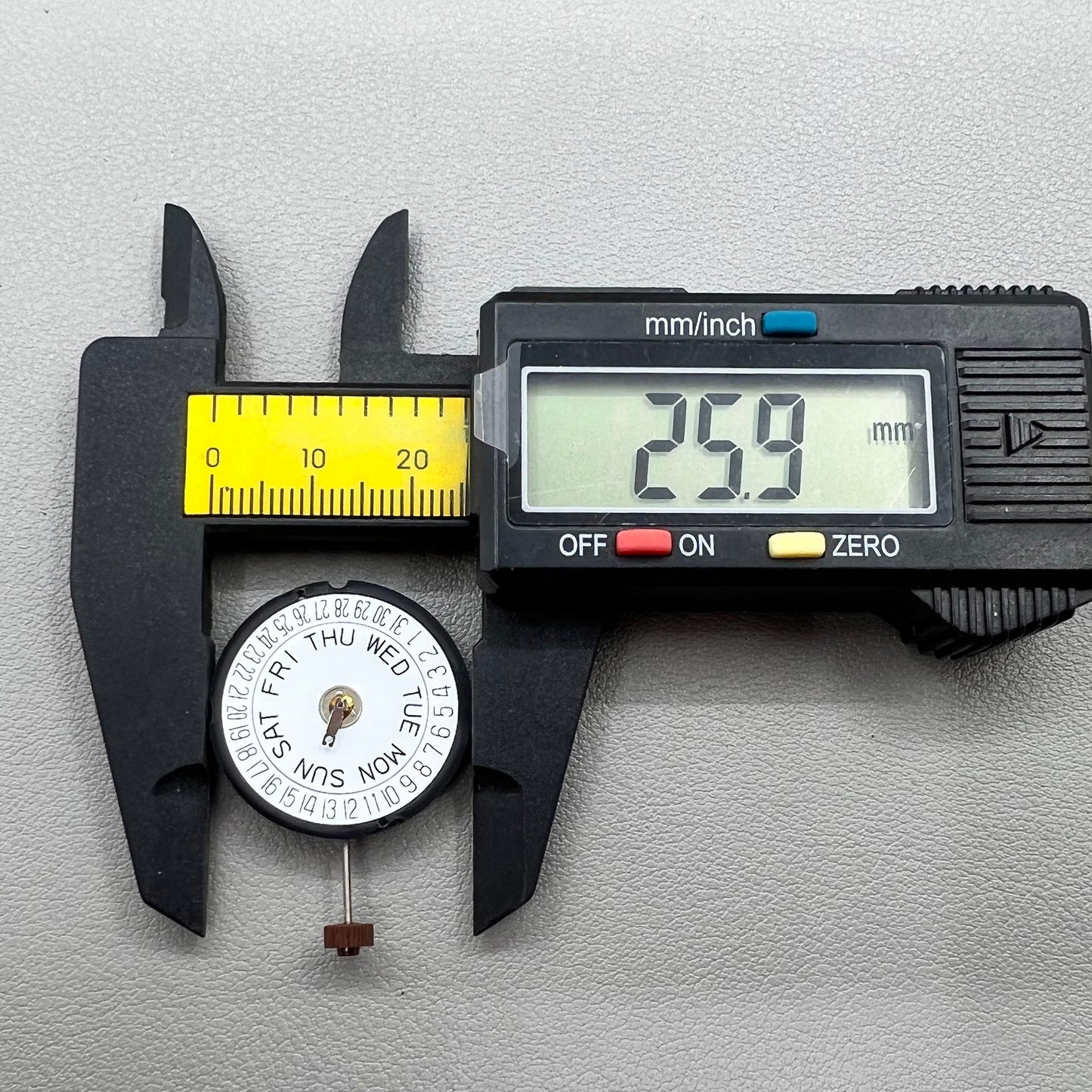 Swiss Ronda 517 quartz watch movement with day and date display at 6 o'clock, precise timekeeping.