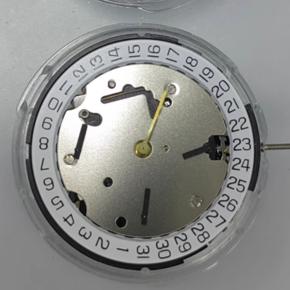 Swiss Made ISA8371 quartz watch movement with date at 6 and small seconds at 3 and 9 positions.