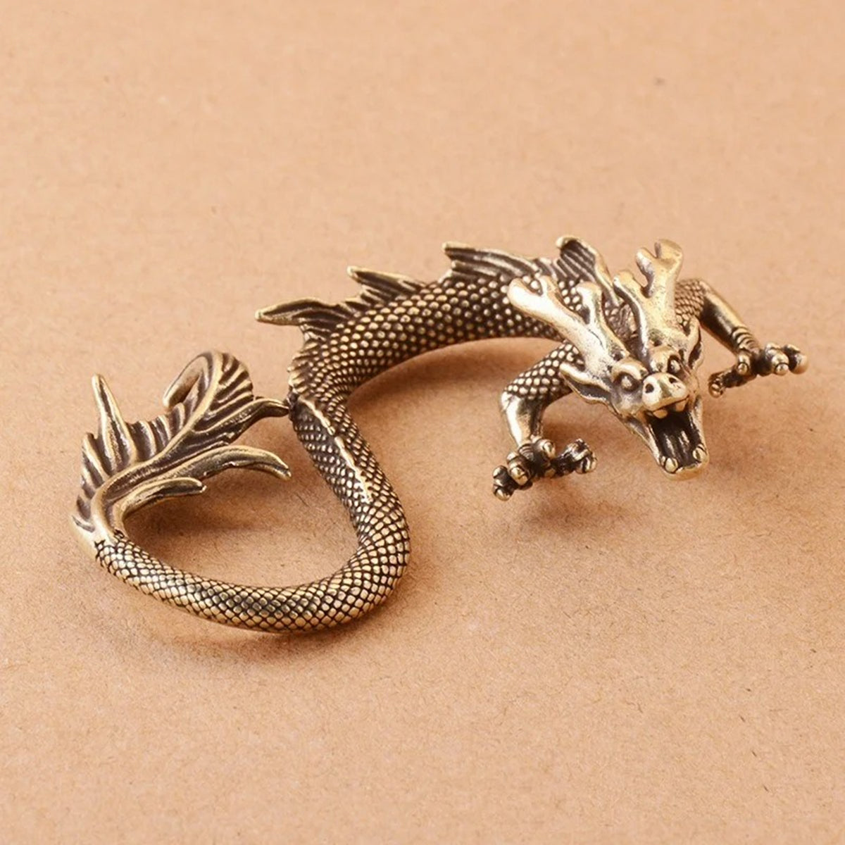 Solid copper fire-breathing dragon trinket with vintage bronze patina, hand-carved collectible figurine.