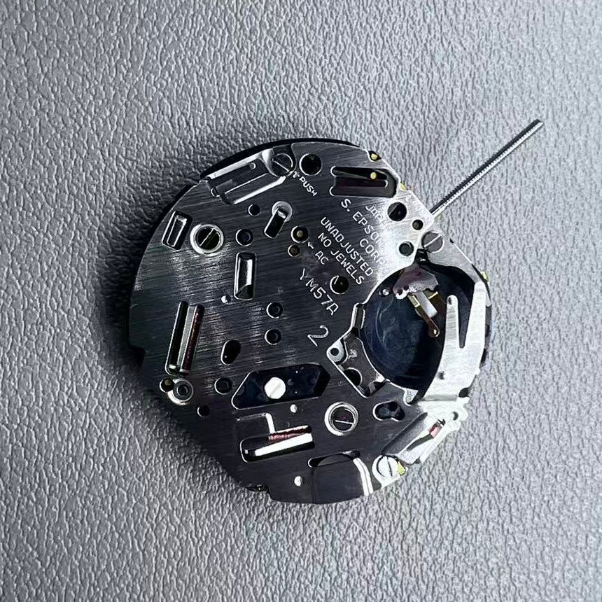 Japan YM57.A watch accessory featuring quartz multifunction movement with small second subdials at 6, 9, and 12 o'clock.