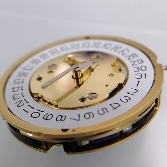 Ronda 5022.B Swiss quartz movement with golden gilted finish, ideal for watch repairs and accessories.
