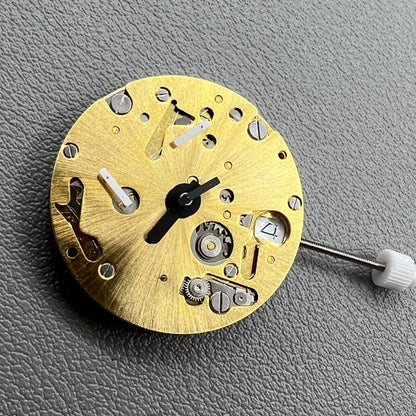 Swiss ISA 9232 quartz watch movement with six hands, date at 3, small seconds at 6/9/12, precision timekeeping.