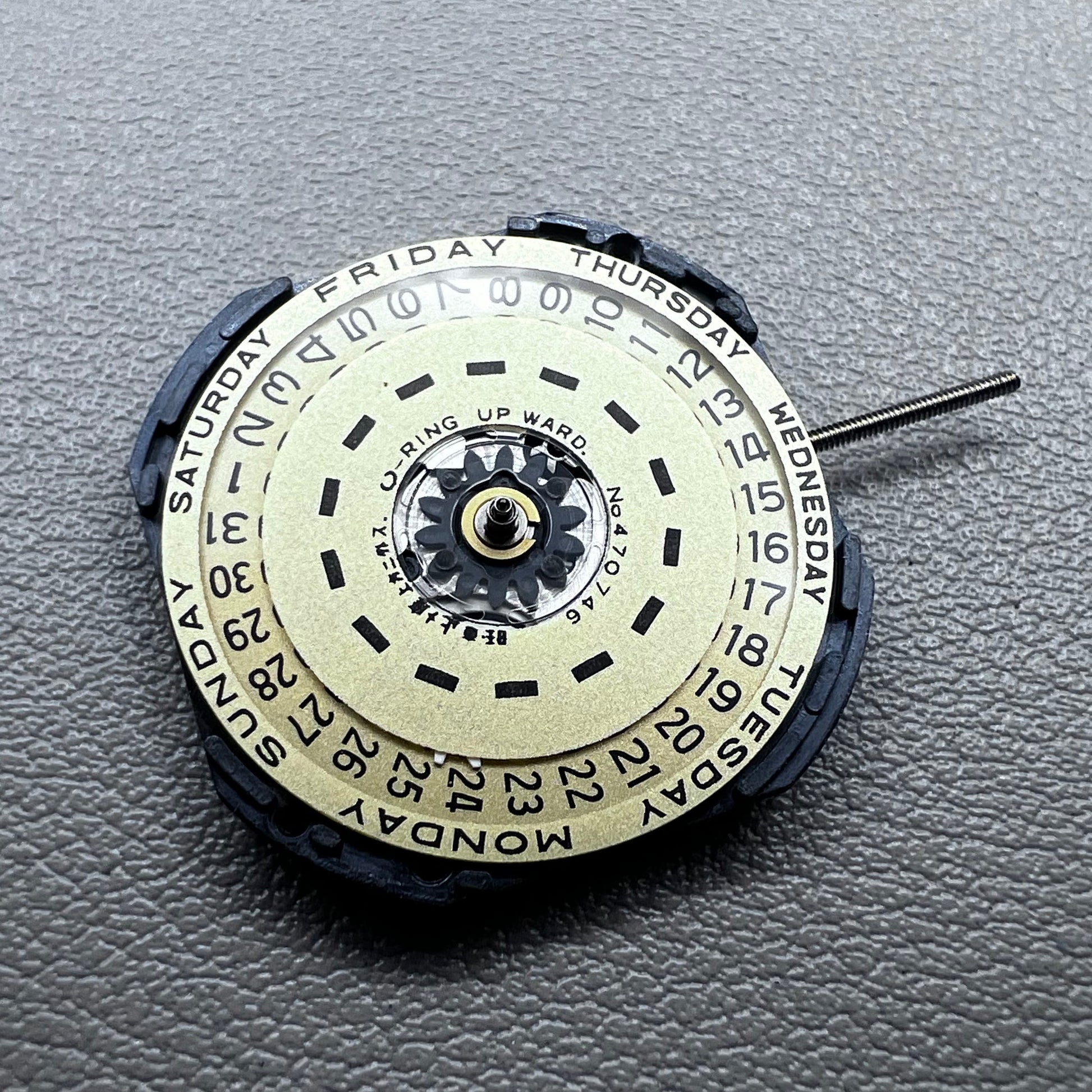 Japan Yl44A quartz watch movement with 3 hands, double calendar, and golden disk detail.