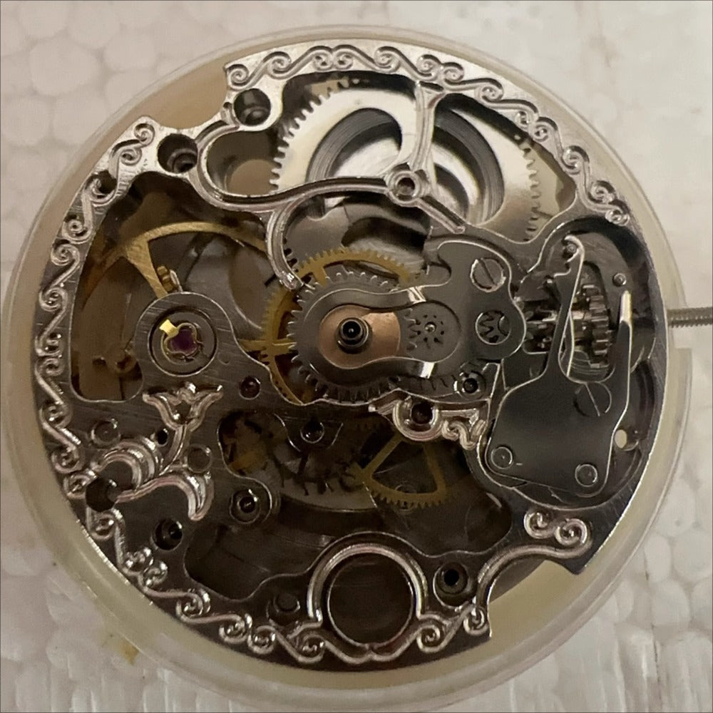 Dandong 7120 mechanical movement watch part showcasing intricate hollow design for precision timepieces.