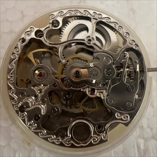 Dandong 7120 mechanical movement watch part showcasing intricate hollow design for precision timepieces.