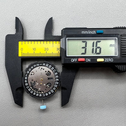 Swiss ETA G10.212 quartz watch movement with date at 4, large hands, small seconds, and black disk by ETA.