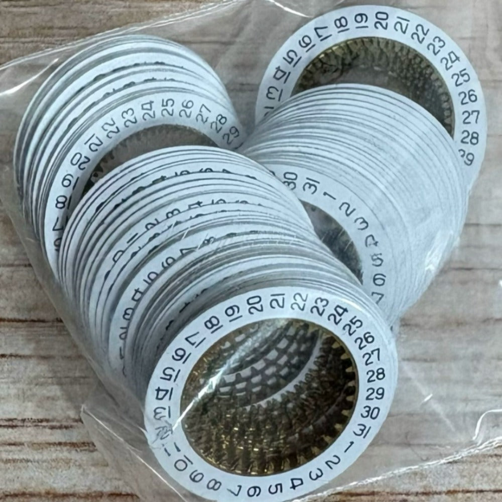 Set of 5 white date disk wheels for Ronda 785 watch movement, date display at 3 o'clock position.