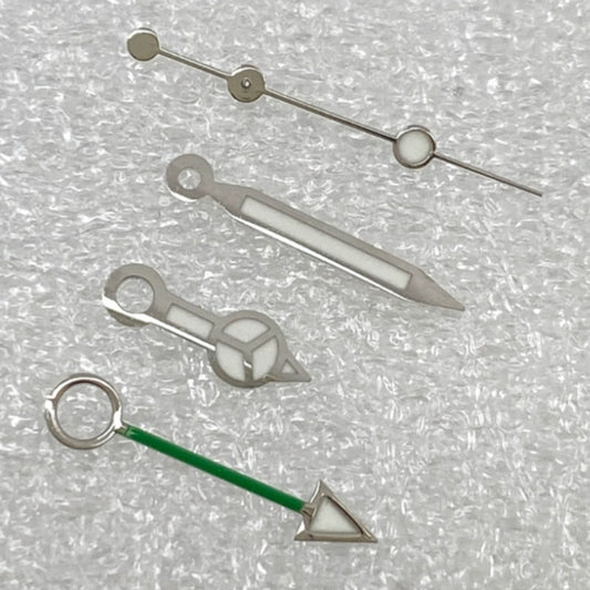 Silver-trimmed green GMT watch hands with BGW9 lume for NH34 movement, enhancing night visibility and precision.