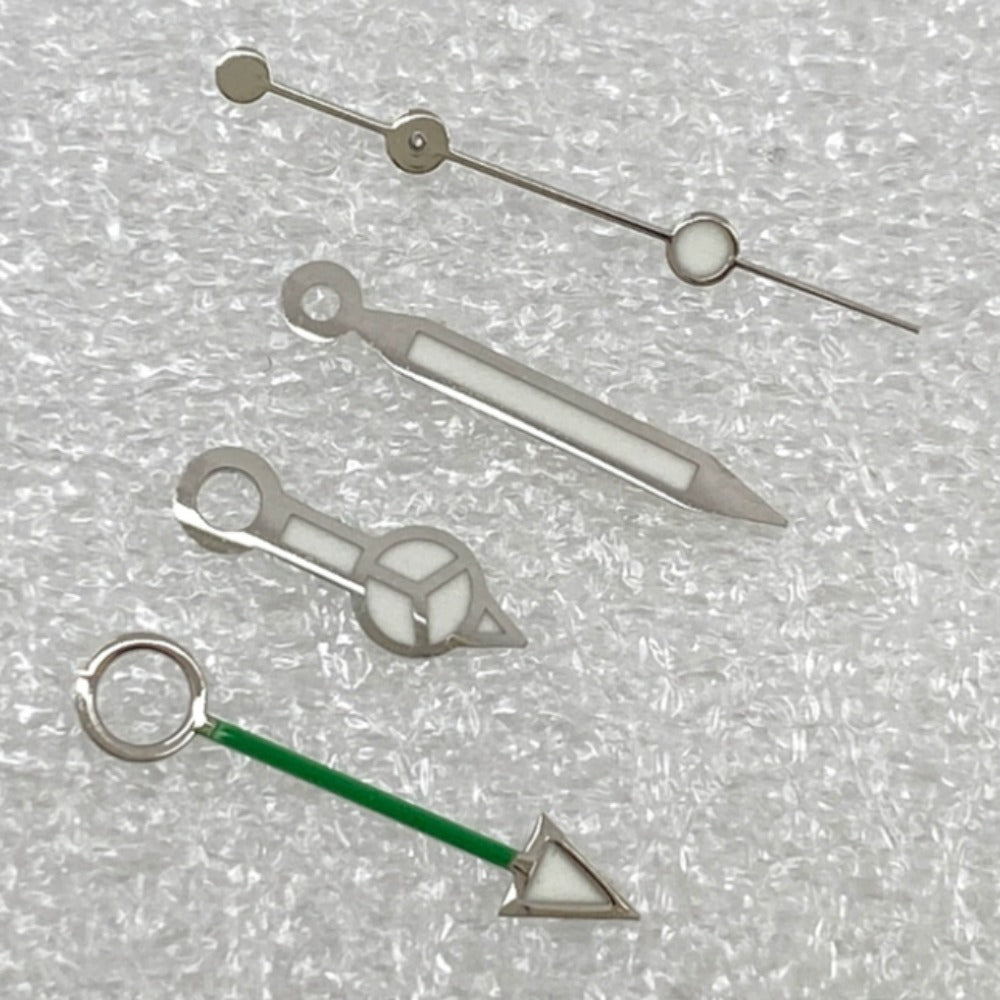 Silver-trimmed green GMT watch hands with BGW9 lume, compatible with NH34 movement, for precise timekeeping.