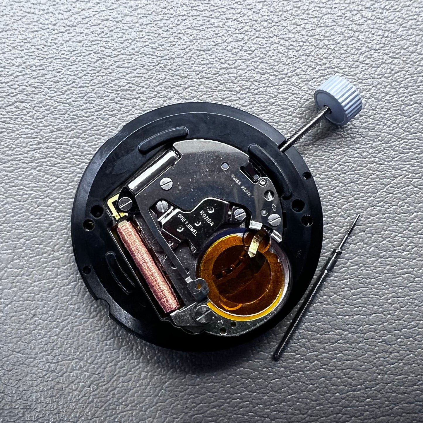 Swiss Ronda 715 quartz watch movement with date display at 3 o'clock, precision timing for accessories.