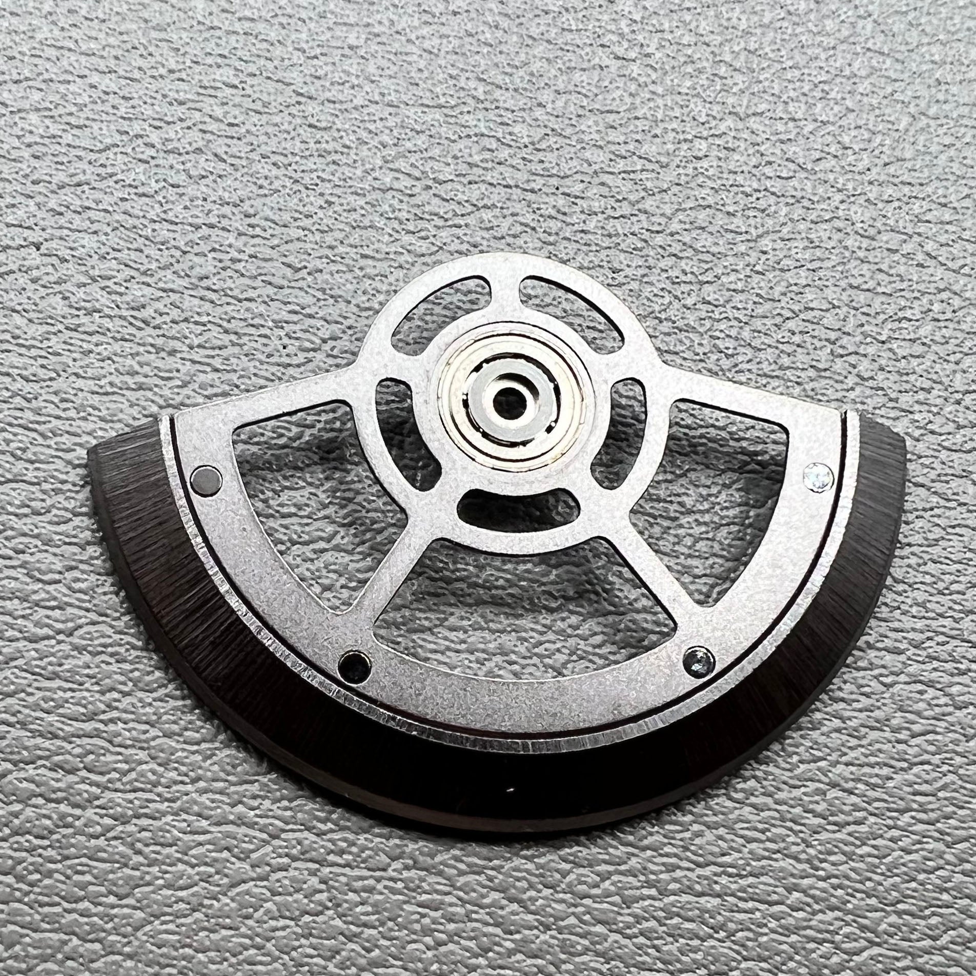Black hollow rotor oscillating weight for China Made SL4802 mechanical watch movement, enhancing precision and style.