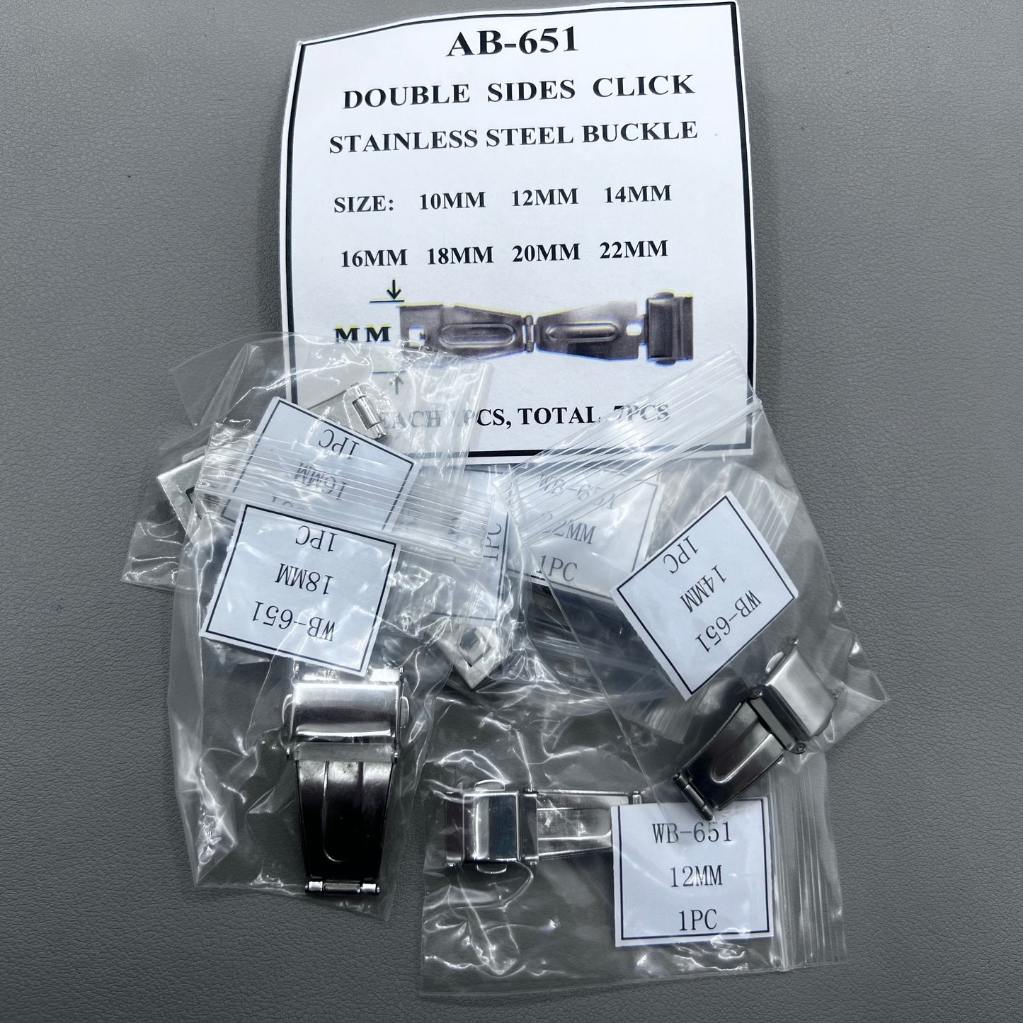 Set of 7 silver stainless steel watch buckles, 10-22mm, polished double-sided for secure clicks.