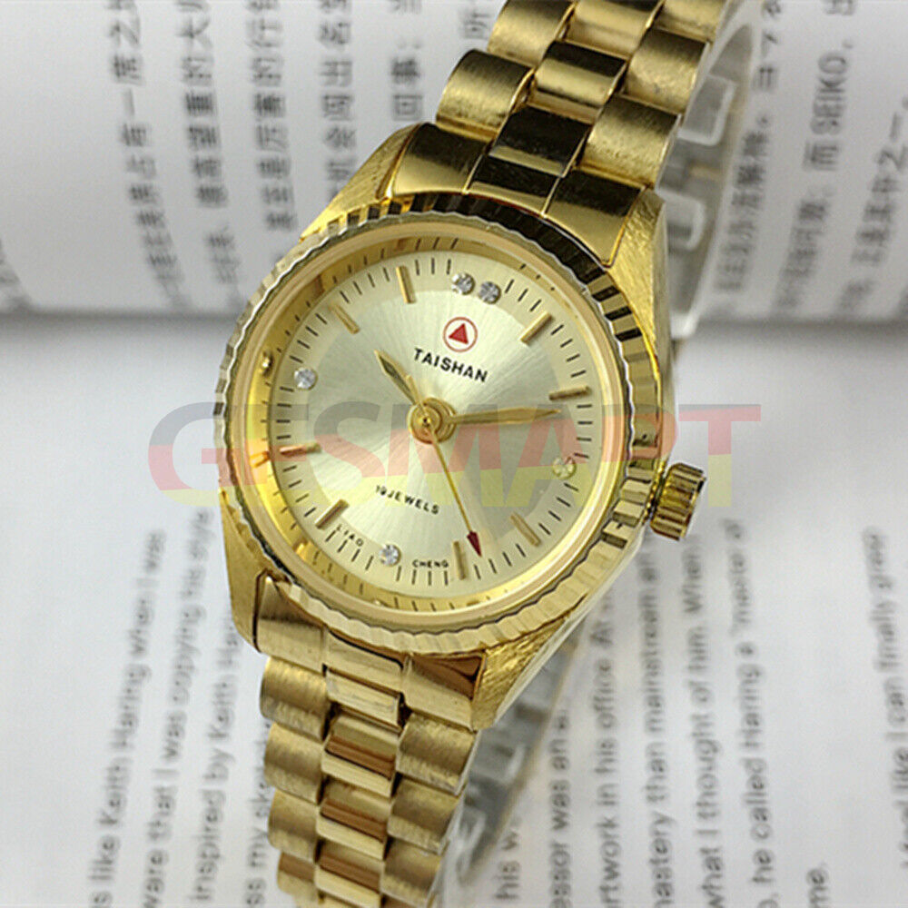 27mm China Made Lady Manual Mechanical Watch with 19 Jewels, golden dial, and nail markers.