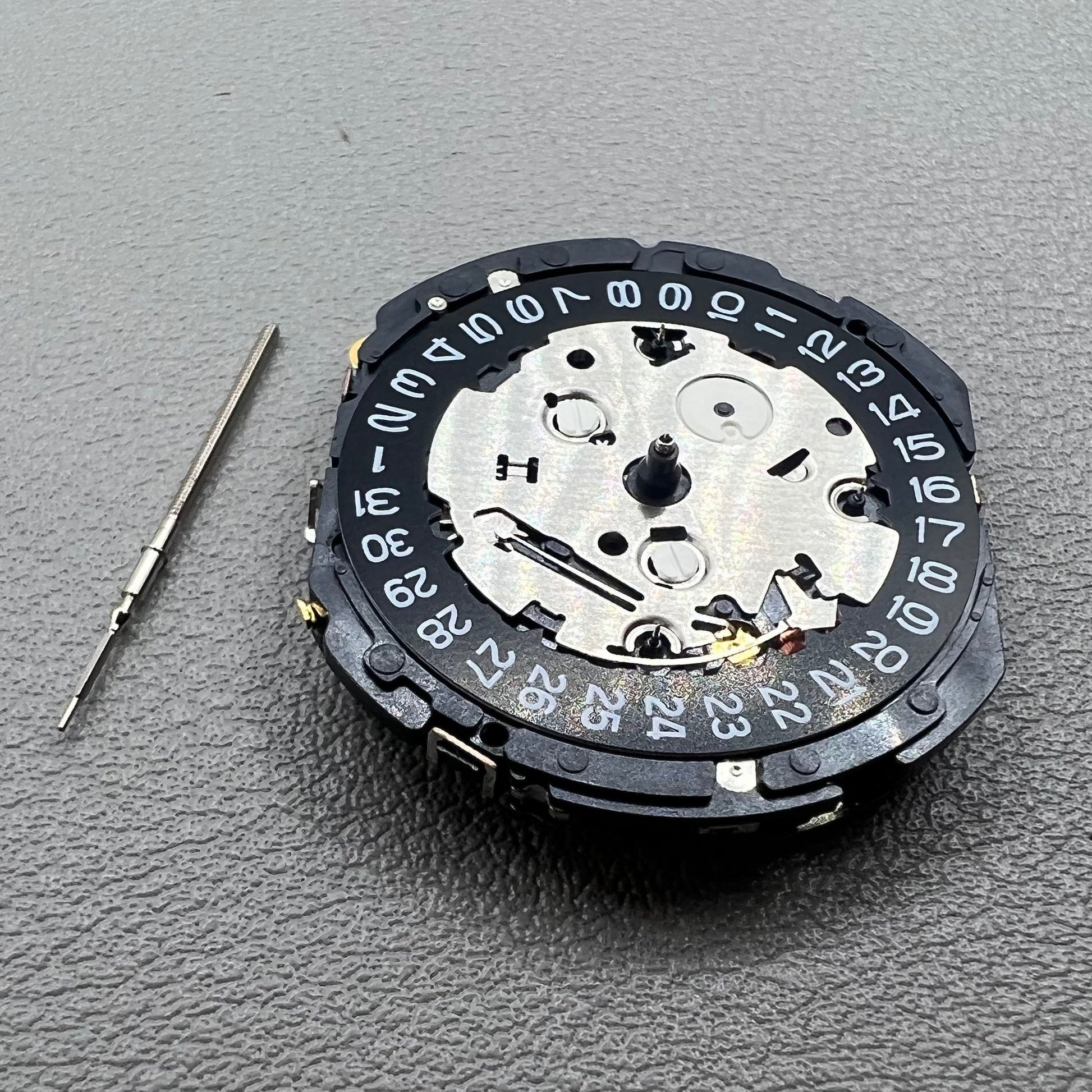 Seiko 7T85A quartz watch movement, precise craftsmanship made in Japan for reliability.