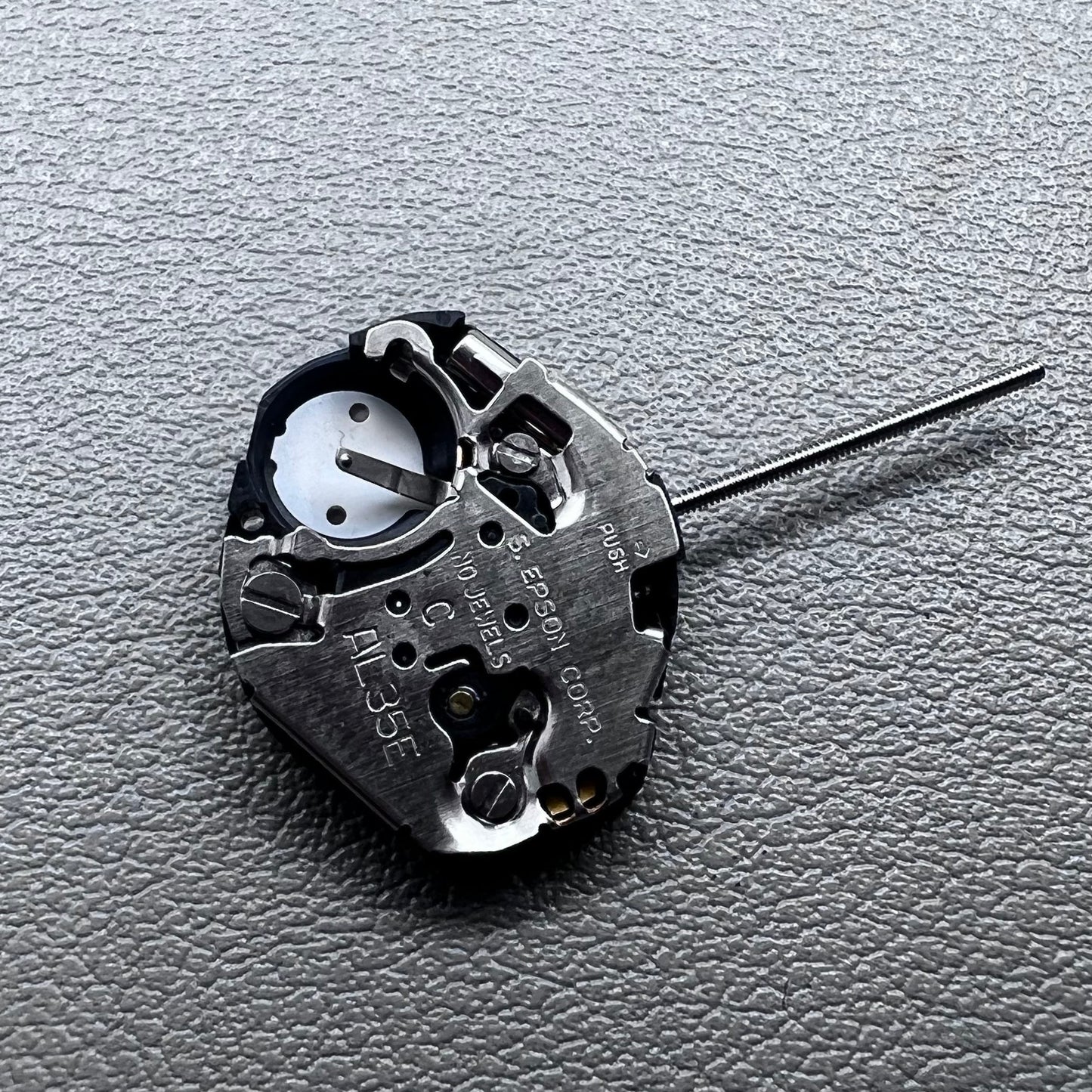 Japan Hattori Epson TMI AL35E quartz watch movement, precise timekeeping for repair and replacement.