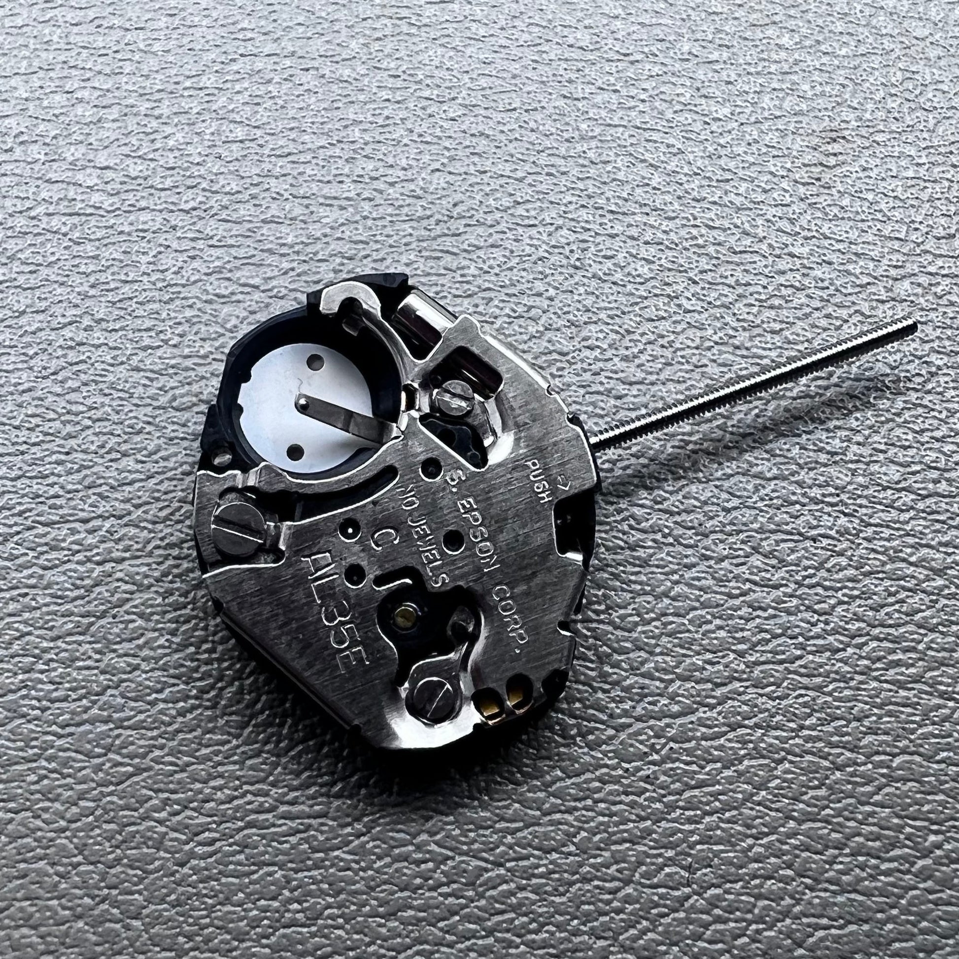 Japan Hattori Epson TMI AL35E quartz watch movement, precise timekeeping for repair and replacement.