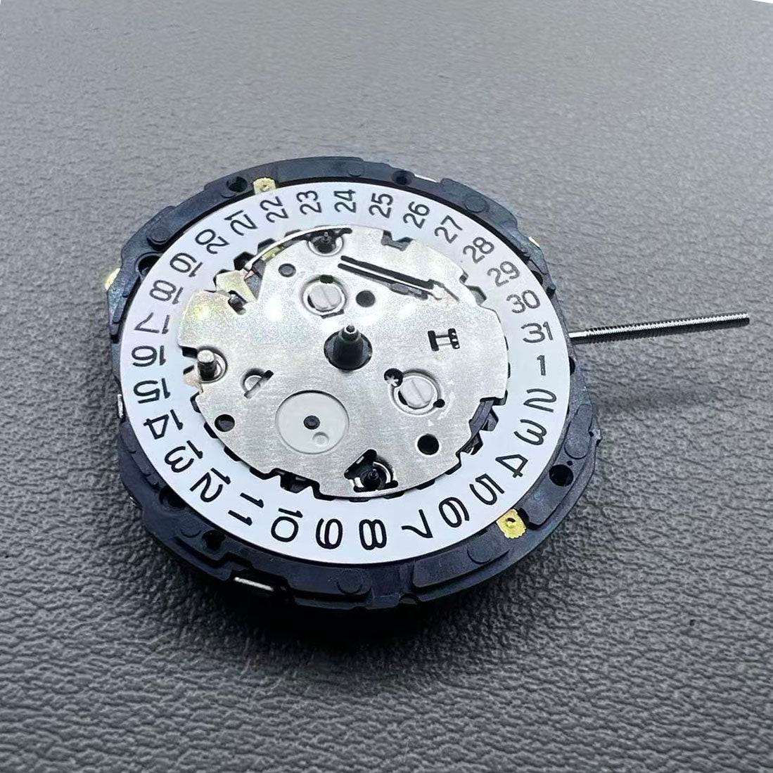 Japan YM57.A watch accessory featuring quartz multifunction movement with small second subdials at 6, 9, and 12 o'clock.