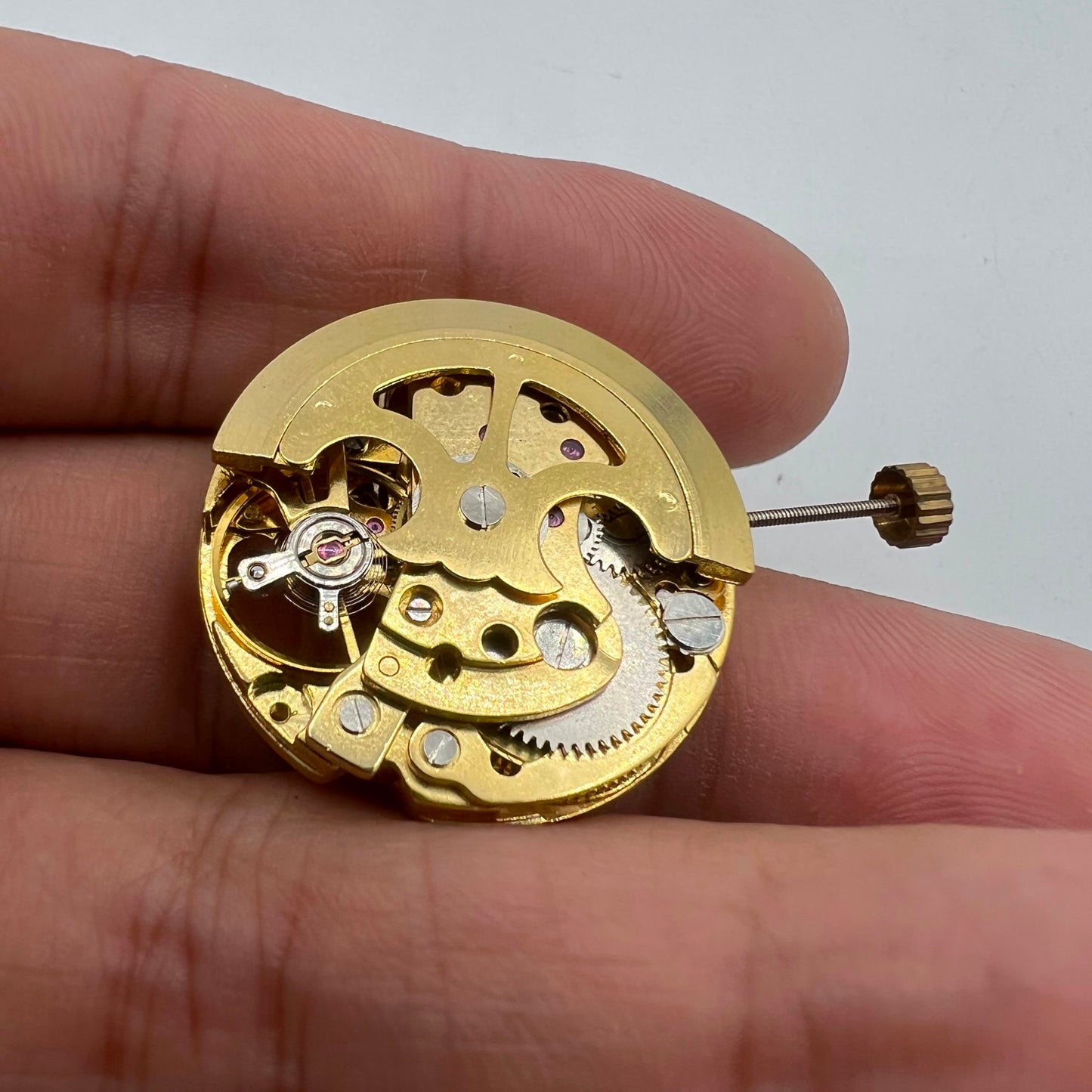 Golden Hollow 26.5mm 7120 automatic watch movement, featuring detailed gears and mechanical precision.