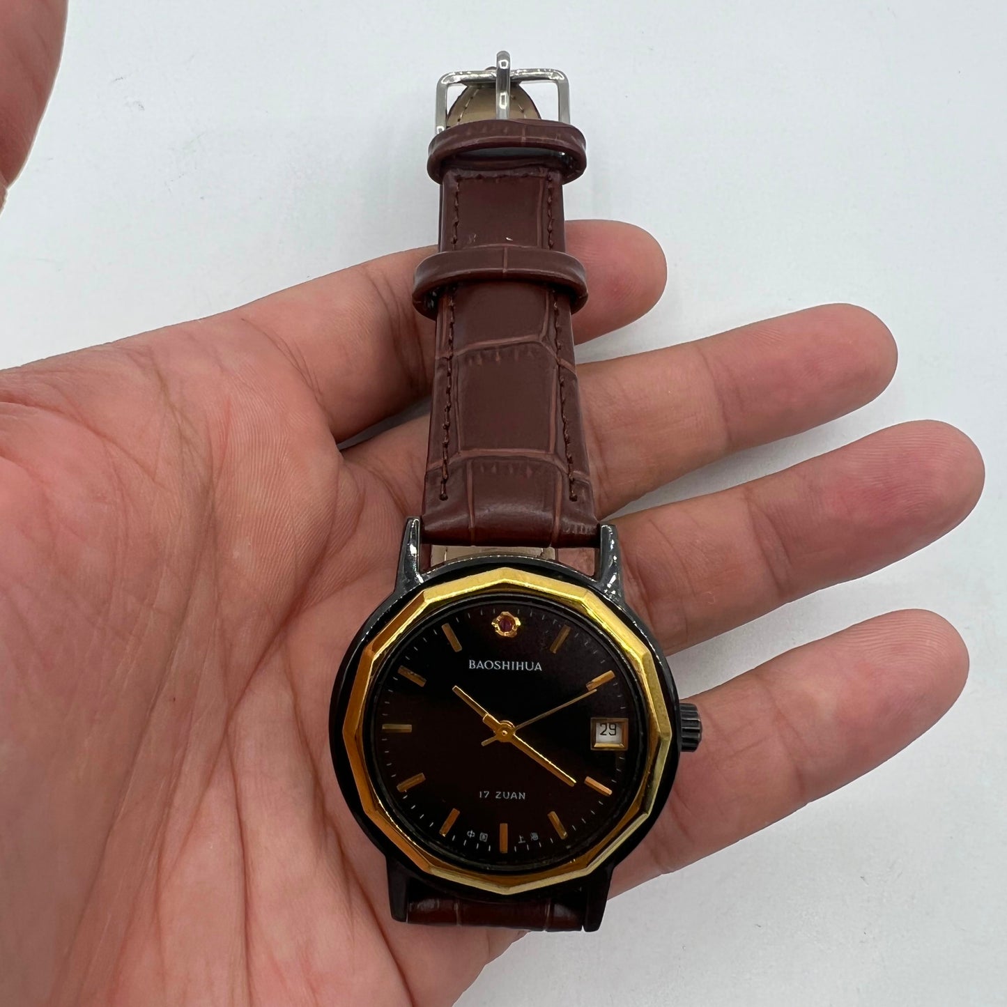 Classic 37mm Shanghai manual mechanical watch with single calendar, black case, and elegant design.