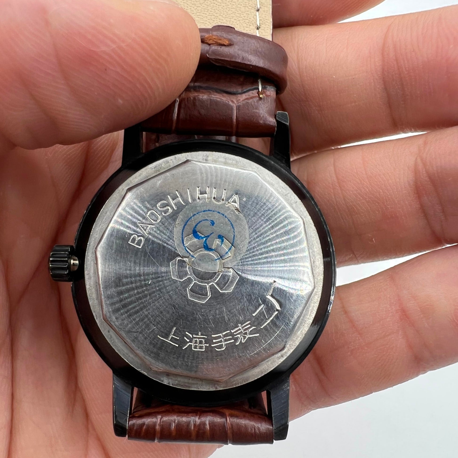 Shanghai 37mm manual mechanical watch with single calendar, black case, classic style for daily wear.