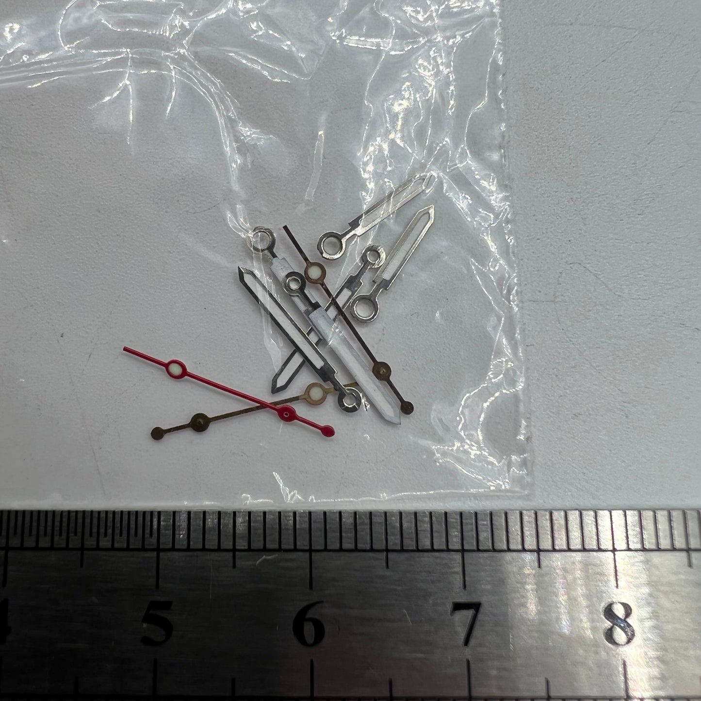 Luminous watch hands by Miyota for 2035 quartz movement, boosting night visibility and time precision.