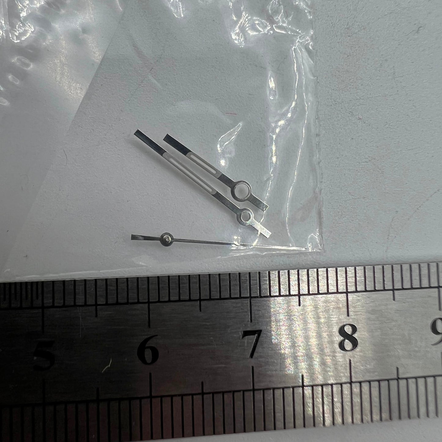 Luminous watch hands by Ronda for 5030.D quartz, ensuring clear time reading in low light.