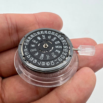 Miyota NH36A automatic watch movement with black finish and green lume, featuring 3 crown positions for accurate timing.